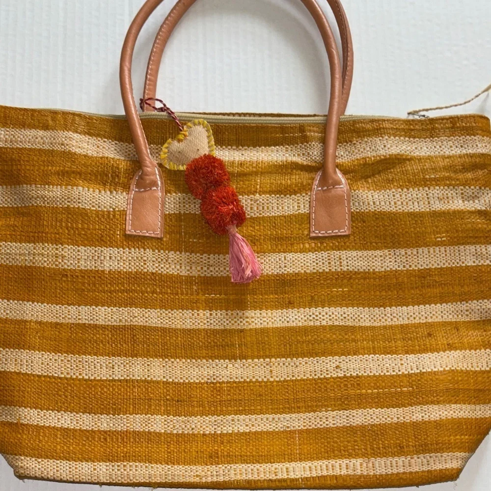 Striped Cream and Golden Orange Women's Woven Straw Bag with Tassel Design